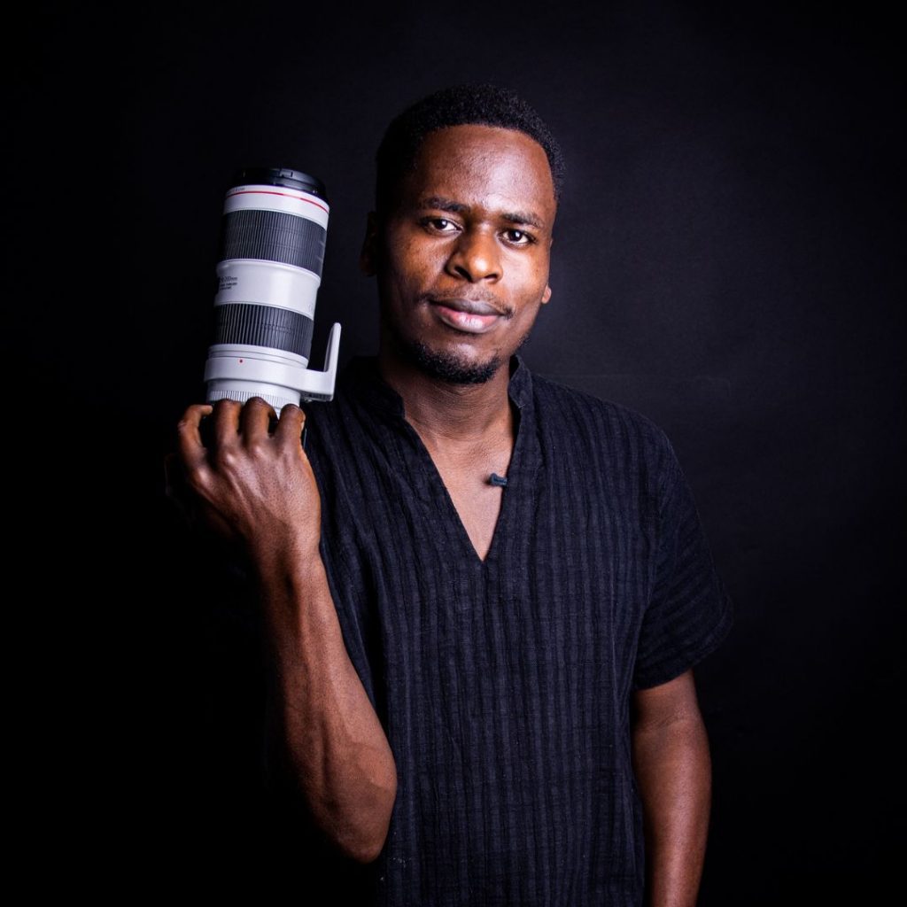 black man with camera lens
