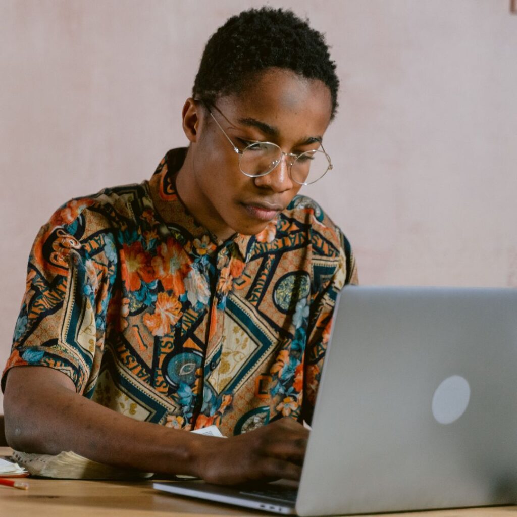 img of an African American man working on a computer